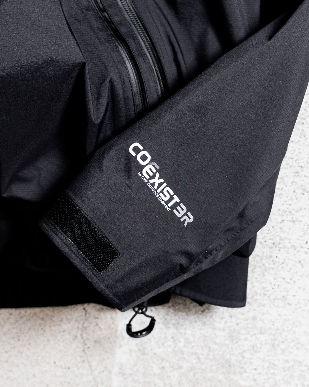 CMF OUTDOOR GARMENT SLASH SHELL COEXIST BRIGHT
