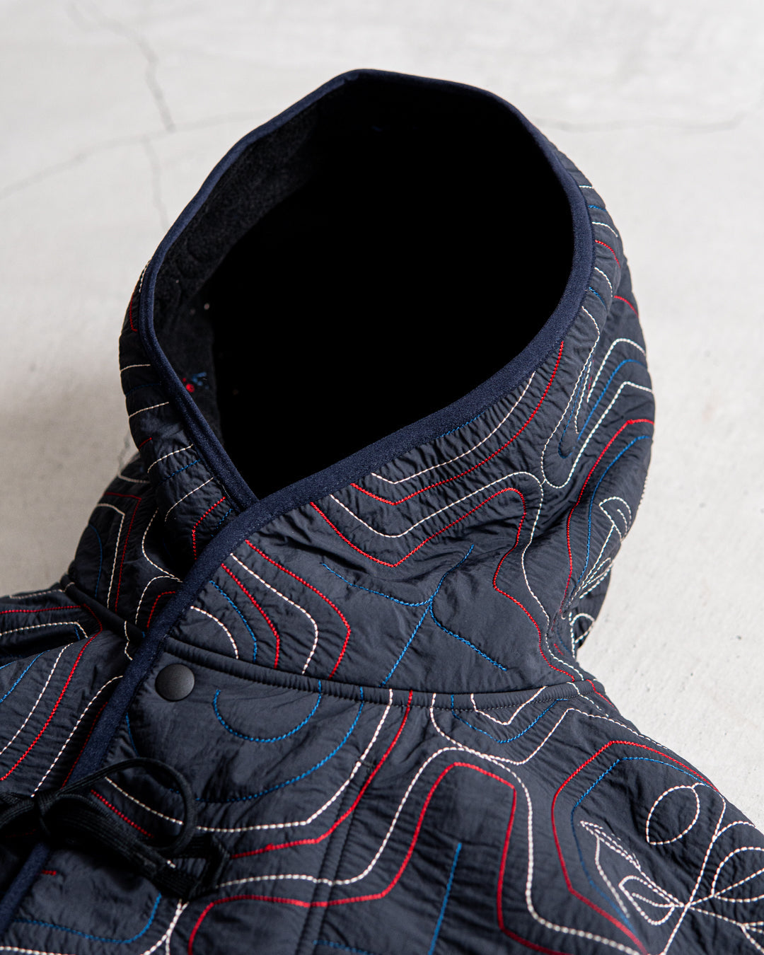 norbit Ainu quilted hood jacket